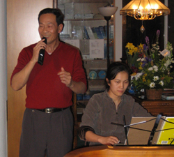 Master Ou  was singing his poem. Amy was playing the music.